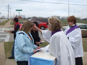 Photo of Episcopal Priest giving Ashes to Go